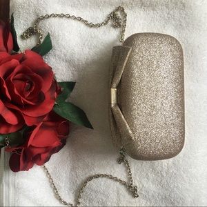 ALDO gold clutch
